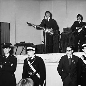 The Beatles performing on stage at De Montford Hall in Leicester, 11th October 1964