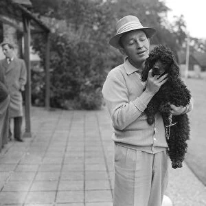 Bing Crosby holding a Poodle - September 1952