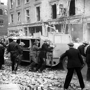 When a bomb fell near a station in London fire appliances were partially buried under