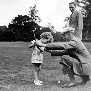 Boys Golf Championship John Havers, aged 4, being taught the game by his uncle