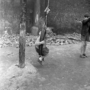 Boys playing at Clydesdale Road adventure playground. 18th May 1955