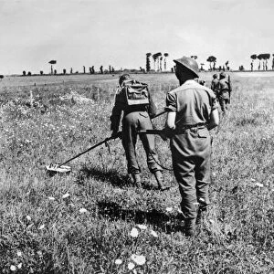 British army soldiers at work searching for enemy mines during the push in to France