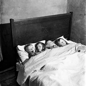 Children of the Duncan family at their home in a Manchester slum