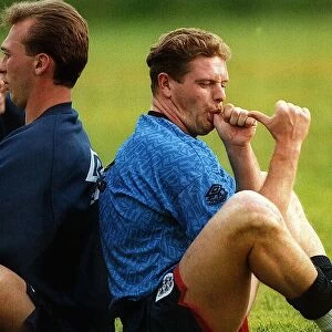 England footballer Paul Gascoigne joking and sucking his thumb as he sits back to back