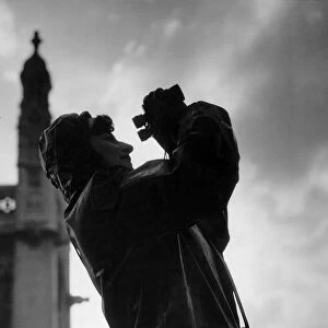 A female plane spotter on the look out for enemy aircraft in the City during the Second