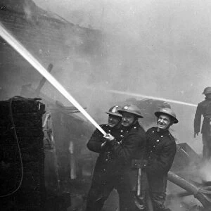 The Great Fire of London. Personnel amidst flame and smoke. 29th December 1940
