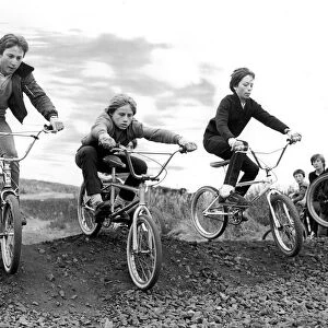 A group of children try out an obstacle on the new BMX track