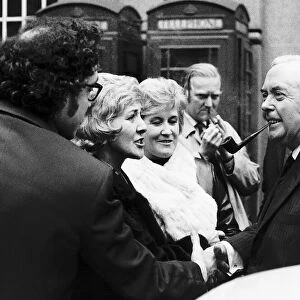 Harold Wilson MP meeting supporters as he leaves the Transport House after the press