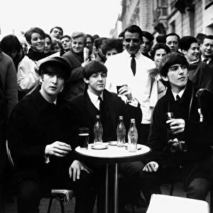 John Lennon, Paul MCCartney & George Harrison on the Champs Elysees before Ringo arrived
