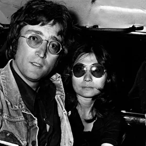 JOHN LENNON AND YOKO ONO IN LIMO AFTER ARRIVING AT LAP FROM MAJORCA