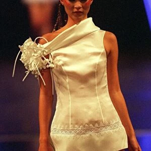 Kate Moss models white off the shoulder wedding dress at London Fashion week 1997