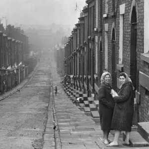 Liverpool housewives seen here gossiping in the street. Women holding parcel