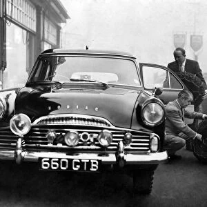 Loading the Ford Zodiac estate car, in which he will compete in the Monte Carlo rally