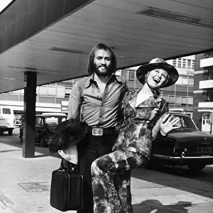 Lulu singer with her husband Maurice Gibb of the pop group the Bee Gees arrive at London