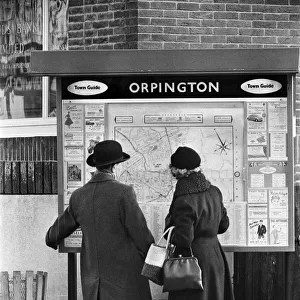 A man and woman looking at a map of Orpington, Orpington High Street, Kent