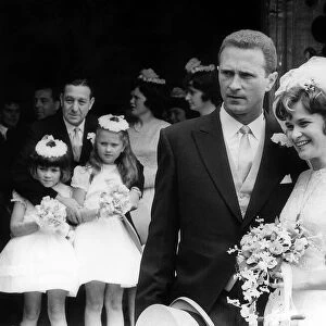 Manchester United goalkeeper Harry Gregg with his bride Carolyn Mauders watched by