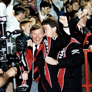Manchester United manager Alex Ferguson celebrates with assistant Brian Kidd as his team
