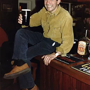 Melvyn Hayes Actor Publican in his Pub in St Albans Hertfordshire Sitting on Bar