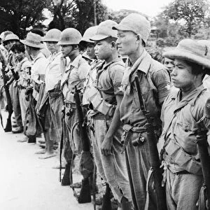 Men of the Patriot Burmese Forces are lined up prior to starting out for a Japanese