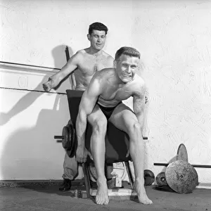 Mens Health: Body builder Larry Stevens seen here with his training coach exercising