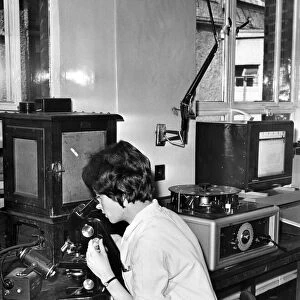 Miss Elspeth Knight examining a blood film at Haematology Department of the Cardiff Royal