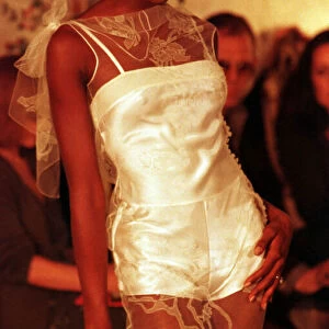 Naomi Campbell in John Galliano Show Paris Fashion 1997 wearing a short white dress with