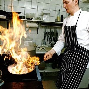 Nick Nairn chef cooking in kitchen flambe preparing starter restuarant Aberfoyle
