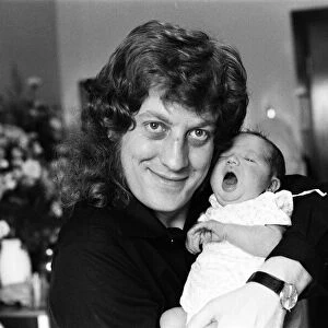 Noddy Holder with his baby daughter Jessica. 8th September 1978