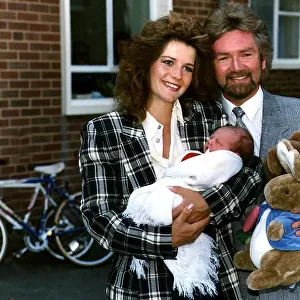 Noel Edmonds TV Presenter and Personality with wife Helen and baby daughter Olivia