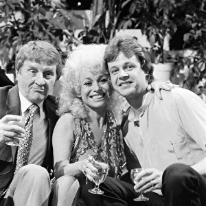 Norman Collier with Barbara Windsor and her boyfriend Stephen Hollings filming a TV show