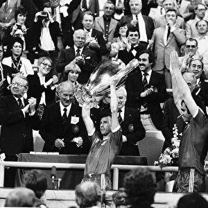 Nottingham Forest captain John McGovern lifts the trophy with team mates behind after