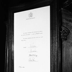 The official announcement of the birth of Prince William pinned to the gates of