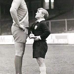 Pocket-sized referee telling off a tall footballer at Reading in Berkshire. February 1980
