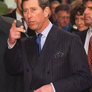 Prince Charles pointing right finger as he enters the Tron Church in Edinburgh