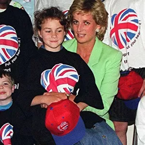Princess Diana with Danielle Stephenson sitting on her knee during a visit to