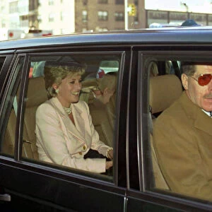 Princess Diana smiling wearing creme jacket in limousine in Harlem, New York
