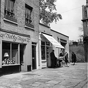 A quaint by-way of Kensington, Church Walk. London. Picture shows a toy shop