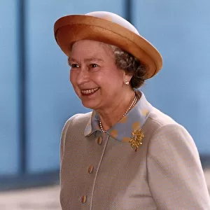 Queen Elizabeth wearing light brown suit and hat, arrives at the Guildhall in London