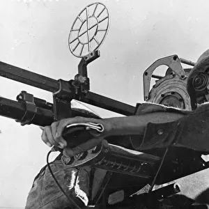 R. A. F. manning an anti-aircraft gun. Pictured in Great Britain, possibly England