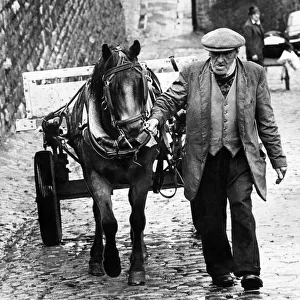 A rag and bone man with his horse and cart