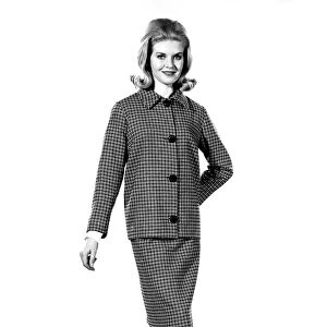 Reveille Fashions 1964: Maureen Walker modeling a twin set. January 1964 P007621