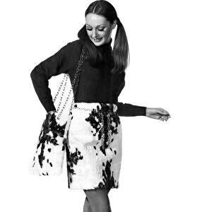 Reveille Fashions: Justyne. wearing goat skin skirt and matching handbag