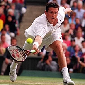 Richard Krajicek stretches for the ball against MaliVai Washington in the mens final at