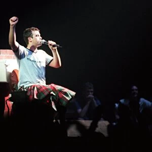Robbie Williams wearing kilt sitting on toilet February 1999 during SECC concert Glasgow