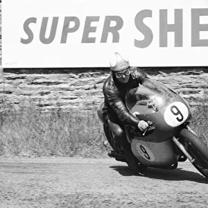 Senior TT race, Isle of Man. Mike Hailwood in action. 8th June 1964