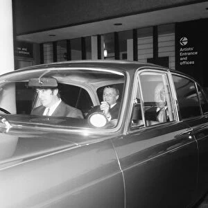 Singer Frank Sinatra pictured as he left the Festival Hall by Jaguar car with the rear
