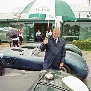 Sterling Moss with a C-Type Jaguar which he piloted to Le Mans 40 years ago