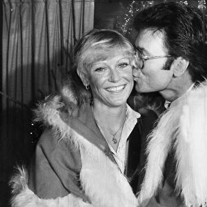 Sue Barker and Cliff Richard kissing at Variety Club event - December 1983