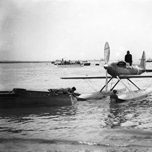 A Supermarine S6B Seaplane powered by a Rolls Royce engine seen here being towed back to