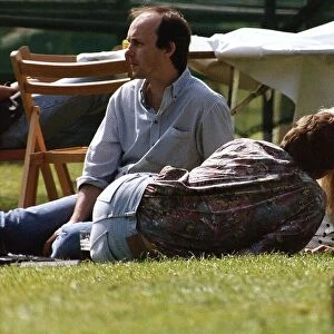 Suzanne Dando TV Presenter with boyfriend Christopher Qakes laying on grass kissing